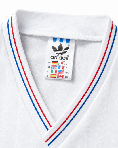 Col en V liseré rouge et bleu du maillot OM 1990/91 domicile