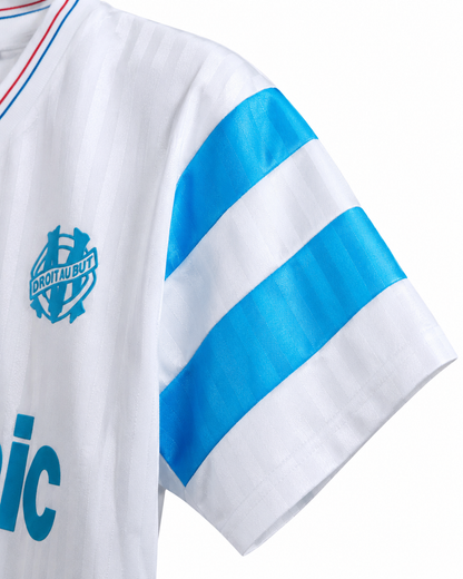 Bandes bleu ciel sur la manche du maillot Marseille 1990